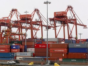 Cranes stack containers from cargo ships at the Port of Vancouver on October 16, 2008. Nowadays households can buy products for less, in real prices, than they could before the globalization of markets, Stéphane Forget writes.