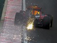 Sparks fly as Max Verstappen steers his Red Bull steers his Red Bull during practice for the Hungarian Grand Prix.