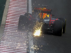 Sparks fly as Max Verstappen steers his Red Bull steers his Red Bull during practice for the Hungarian Grand Prix.