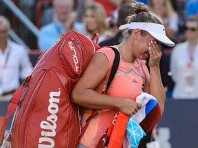 Kristina Kucova of Slovakia cries after losing to Madison Keys of the United States as she walks off the court during day six in semifinal round action of the Rogers Cup at Uniprix Stadium on July 30, 2016, in Montreal.