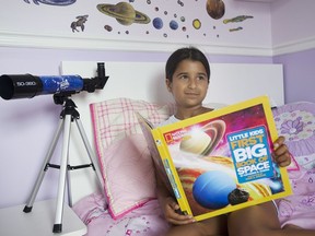 Eight year old space enthusiast Sahana Khatri poses for a portrait at her home in Vaudreuil-Dorion, Que., west of Montreal on Saturday, July 23, 2016.
