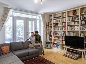 Pemma Muzumdar, right, and her boyfriend Mathieu Sirois, left, pose for a photograph at Muzumdar's home in the Plateau-Mont-Royal in Montreal on Tuesday, July 12, 2016.