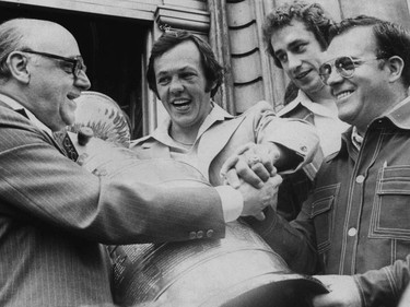 May 1976: At the conclusion of the Canadiens' Stanley Cup parade (their first of four consecutive), Mayor Jean Drapeau (far left) welcomed the Stanley Cup on the steps of City Hall with Canadiens (from left) Yvan Cournoyer, Bob Gainey and head coach Scotty Bowman.