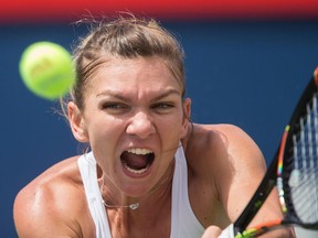 Romania's Simona Halep returns a shot to Russia's Svetlana Kuznetsova during their Rogers Cup quarter-final match at Uniprix Stadium in Montreal, on July 29, 2016.