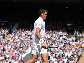 Canada's Milos Raonic reacts after losing point to Britain's Andy Murray during the men's singles final at Wimbledon on July 10, 2016.