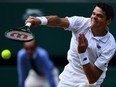 Canada's Milos Raonic returns to Britain's Andy Murray during the men's singles final match on the last day of the 2016 Wimbledon Championships at The All England Lawn Tennis Club in Wimbledon, southwest London, on July 10, 2016.