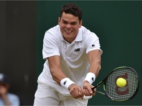 Canada's Milos Raonic returns against Belgium's David Goffin during their men's singles fourth round match on the eighth day of the 2016 Wimbledon Championships at The All England Lawn Tennis Club in Wimbledon, southwest London, on July 4, 2016. /