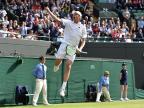American Sam Querrey, ranked No. 41 in the world, celebrates after upsetting Serbia's Novak Djokovic, ranked No. 1, in third round match at Wimbledon on July 2, 2016.