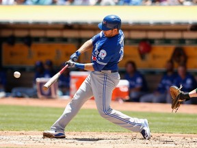 Josh Thole of the Toronto Blue Jays hits a two-run double in the second inning against the Oakland Athletics at O.co Coliseum on July 16, 2016, in Oakland, Calif.