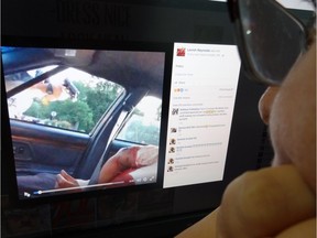 An editor watches July 7, 2016 in Washington, DC a video showing the dying moments of a black man shot by Minnesota police after being pulled over while driving. A woman, identified on her Facebook page as Lavish Reynolds, livestreamed her boyfriend's dying moments after a new police shooting a day after a similar event in Louisiana. Police confirmed the shooting by an officer. Family and activists identified the victim as school cafeteria worker Philando Castile, 32. Castile can be seen in the driver seat, large blood stains spreading through his white shirt. Reynolds sat next to him and her young daughter was also traveling in the car.STF/AFP/Getty Images
