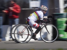 Marie-Eve Croteau of Quebec City races in the T2 tricycle category of the cycling competition, as part of the  Defi Sportif for athletes with disabilities at the Circuit Gilles Villeneuve in Montreal, Saturday April 28, 2012.
