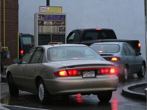 Vehicles idling in an early-morning drive-through lineup at Tim Horton's.