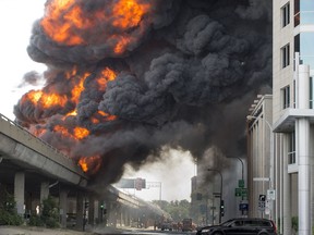 A tractor trailer carrying fuel burns on the elevated highway by Cremazie and Basile Routhier in Montreal, on Tuesday, August 9, 2016.