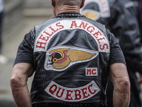 A Quebec Hells Angels member arrives for the funeral of Kenny Bedard, a member of the Hells Angels who was killed in a motorcycle crash on July 29, at the St-Charles Church in the Pointe-St-Charles neighbourhood in Montreal on Saturday, August 13, 2016.