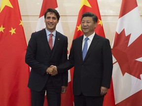 Chinese President Xi Jinping welcomes Canadian Prime Minister Justin Trudeau to the Diaoyutai State Guesthouse in Beijing, Wednesday August 31, 2016.