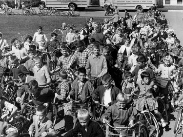 1959: Children, children, and more children. The cost of building schools as the suburbs spread was a major headache for suburban communities. Valois Park School (in what is now Pointe-Claire) was so crowded that it had five classrooms in the basement and had not been able to use its library, except as a classroom. Still lots of plaid going on with the boys and there are very straight bangs all around. The girls have lovely thick wool coats, with big buttons and fancy collars.