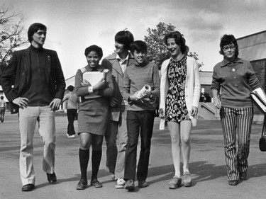 1971: (L-R) Daniel Sirois, Marie Guillote, Denis Allard, Gary Ward, Jose Rivard and Dawn Coulombe outside their Cowansville school. Very groovy kids. Everyone's making a statement. You don't see striped pants much anymore. Are those clogs?