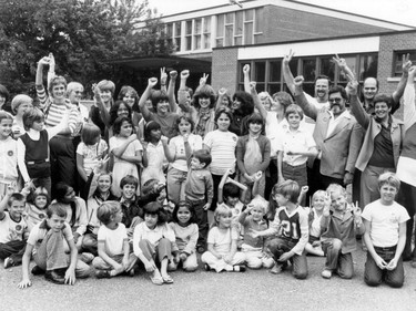 1982: Students of Notre Dame School cheer over a decision to keep their school open. This being the year after Princess Diana and Prince Charles got married, short hair on girls is in, but nobody can protect them from the acid-wash jeans that are just around the corner.