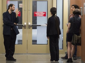 Members of the public and media wait to enter the courtroom at the Montreal Courthouse, Saturday, August 20, 2016, on day eight of jury deliberations in the Richard Henry Bain murder trial.