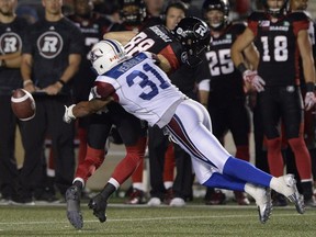 Ottawa Redblacks' Brad Sinopoli (88) is stripped of the ball by Montreal Alouettes' Winston Venable (31) during second half CFL action on Friday, Aug. 19, 2016 in Ottawa.