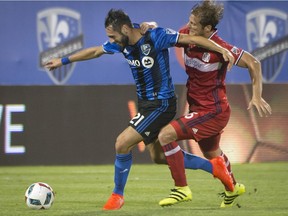 Chicago Fire's Eric Gehrig, right, and Montreal Impact's Matteo Mancosu battle for the ball during first half MLS action in Montreal on Saturday, August 20, 2016.