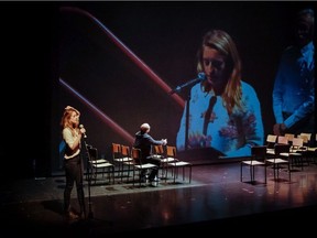 Christine Beaulieu plays herself in J'aime Hydro, while Mathieu Gosselin watches her speak during a public consultation.