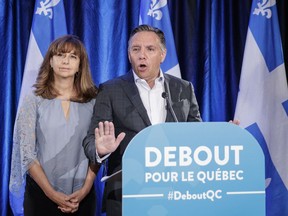 CAQ Leader François Legault and Nathalie Roy, CAQ immigration critic, speak to the media in St-Jérôme in August 2016. The party wants to reduce the number of immigrants to Quebec to 40,000 per year.