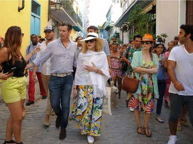 Singer Madonna walks along a street in Havana, where she was celebrating her 58th birthday, on Tuesday, Aug. 16, 2016.