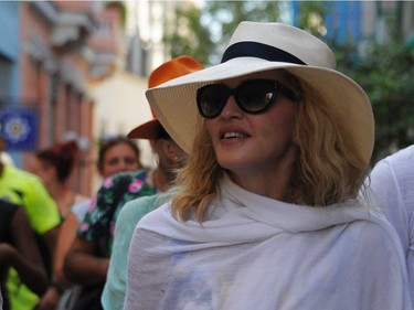 Singer Madonna walks along a street in Havana, where she was celebrating her 58th birthday, on Tuesday, Aug. 16, 2016.