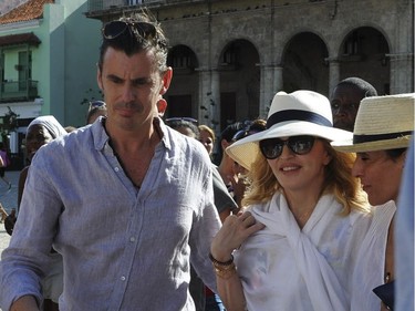 Singer Madonna walks along a street in Havana, where she was celebrating her 58th birthday, on Tuesday, Aug. 16, 2016.
