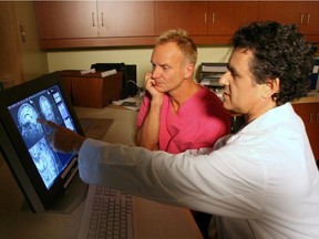 Daniel Levitin,  cognitive psychologist at McGill University, is seen showing Sting his cerebellum after the British pop star agreed to have his brain scanned for an fMRI. The resulting report, co-authored by Levitin and neuroimaging expert Scott Grafton, at the University of California at Santa Barbara, was published in the journal Neurocase. Courtesy of Owen Egan, McGill University