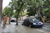 Firefighters walk through a flooded Brewster avenue near the corner of St-Antoine street at the scene where a water main break caused flooding in the borough of St-Henri in Montreal on Saturday, August 13, 2016.