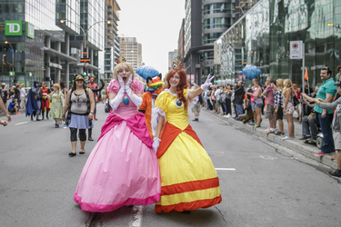 Women in costumes take part in the Montreal Pride Parade through Rene-Levesque boulevard in downtown Montreal on Sunday, August 14, 2016.
