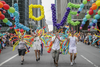 People take part in the  Montreal Pride Parade through Rene-Levesque boulevard in downtown Montreal on Sunday, August 14, 2016.