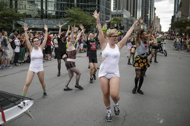 Dancers take part in the Montreal Pride Parade through Rene-Levesque boulevard in downtown Montreal on Sunday, August 14, 2016.