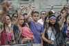 A crowd takes part in a moment of silence during the Montreal Pride Parade through Rene-Levesque boulevard in downtown Montreal on Sunday, August 14, 2016.