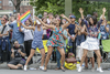People dance as they watch the Montreal Pride Parade as it goes through Rene-Levesque boulevard in downtown Montreal on Sunday, August 14, 2016.