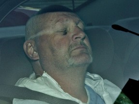 A jury  found Richard Henry Bain guilty of second-degree murder in the killing of stage technician Denis Blanchette. Pictured: Bain in a police car in 2012.