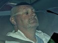 A jury  found Richard Henry Bain guilty of second-degree murder in the killing of stage technician Denis Blanchette. Pictured: Bain in a police car in 2012.