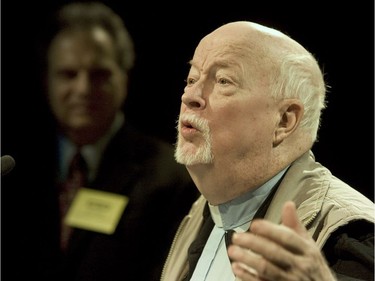 Father Emmett Johns speaks to reporters during the 20th aniversary of Dans La Rue, in 2008. In the background is the centre's director Aki Tchitacov.