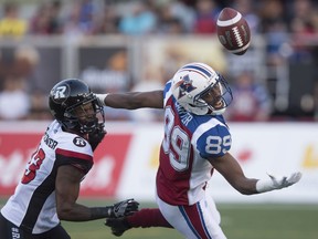 Alouettes wide-receiver Duron Carter, right, battles Redblacks defensive-back Forrest Hightower during a game this season. Carter   is the Als' leading receiver with 46 catches for 717 yards and five touchdowns.