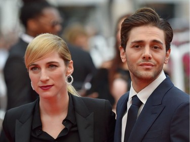 Producer Nancy Grant and Canadian director Xavier Dolan pose as they arrive for the closing ceremony of the 69th Cannes Film Festival in May.