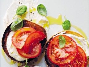 Fresh, ripe tomatoes top fromage blanc on a toasted bagel in this easy summer supper recipe.