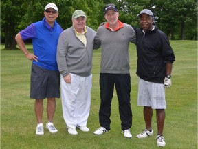 From left: John Chan, president of the board of the Nazareth Community, Father John Walsh, board member George Michael; Marvin Mendez, on June 13, 2016, at the 18th annual Father John Walsh Golf Tournament.