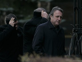 Loris Cavaliere, right, arrives for the 2010 funeral of Nicolo Rizzuto Sr. in Little Italy.