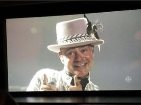 Tragically Hip singer Gord Downie, shown on the screen of the Empire Theatre in Belleville, Ont., mugs for the crowd in neighbouring Kingston, Ont., Saturday, August 20, 2016. Venues across the country screened the live broadcast.