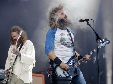 Troy Sanders, right, and Brent Hind of the American heavy metal band Mastodon perform on Day One of the Heavy Montréal music festival at Jean-Drapeau Park in Montreal on Saturday, August 6, 2016.