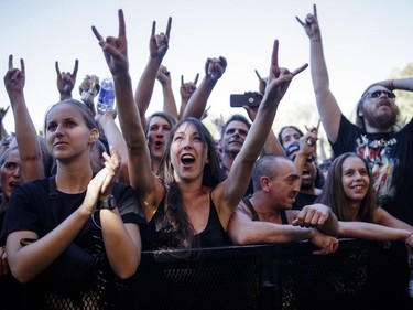 Music fans cheer during the performance by Canadian singer Sebastian Bach on Day One of the Heavy Montréal music festival at Jean-Drapeau Park in Montreal on Saturday, August 6, 2016.