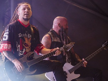 Zoltan Bathory, left, and  Chris Kael of the American heavy metal band Five Finger Death Punch perform on Day One of the Heavy Montréal music festival at Jean-Drapeau Park in Montreal on Saturday, August 6, 2016.