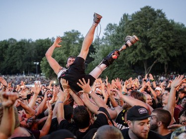 A music fan crowd surfs during the performance by the Finnish metal band Nightwish on Day One of the Heavy Montréal music festival at Jean-Drapeau Park in Montreal on Saturday, August 6, 2016.
